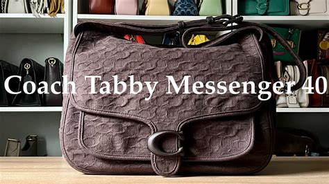 Crafted of buttery soft glovetanned leather, our versatile Tabby Messenger 19 is a modern take on an archival 1970s Coach design. Finished with our Signature hardware for an iconic touch, the compact structured bag has secure interior snap and zip pockets for easy organization and an outside pocket to keep essentials close at hand. The wide …